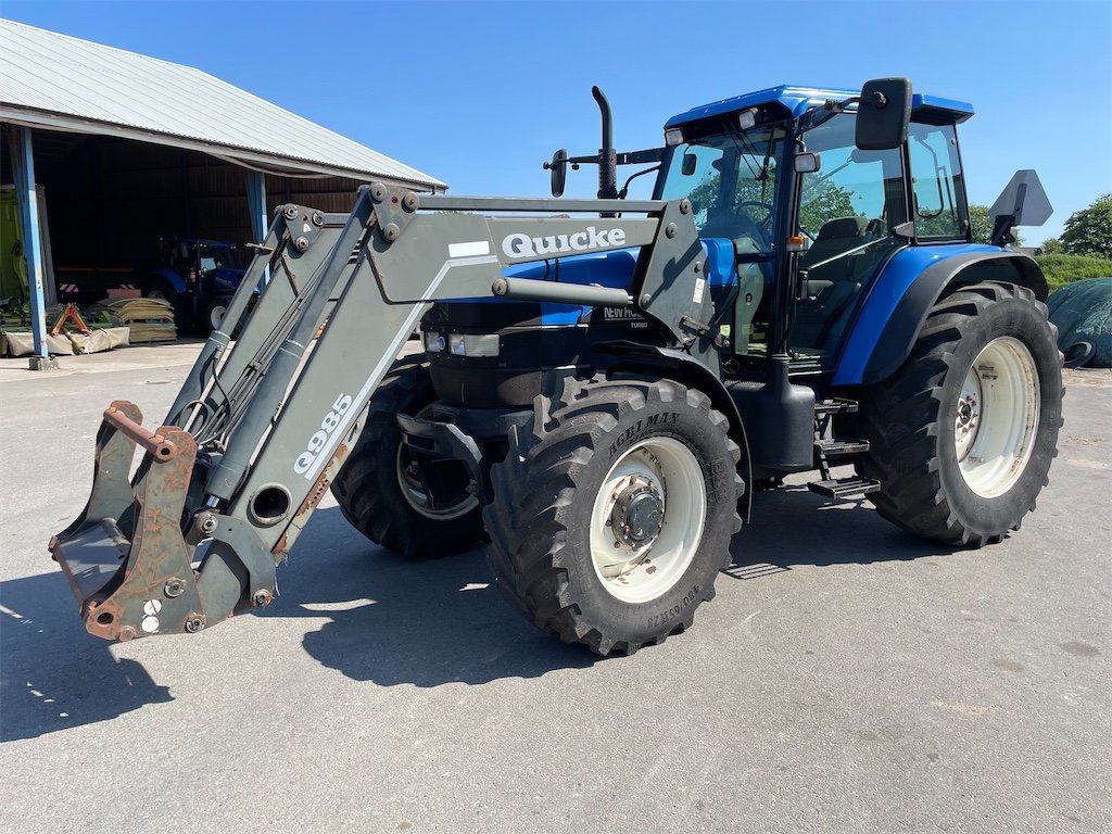 New Holland TM115 4WD 1 new holland tm115 4wd 106 ch 10 328 h 2002